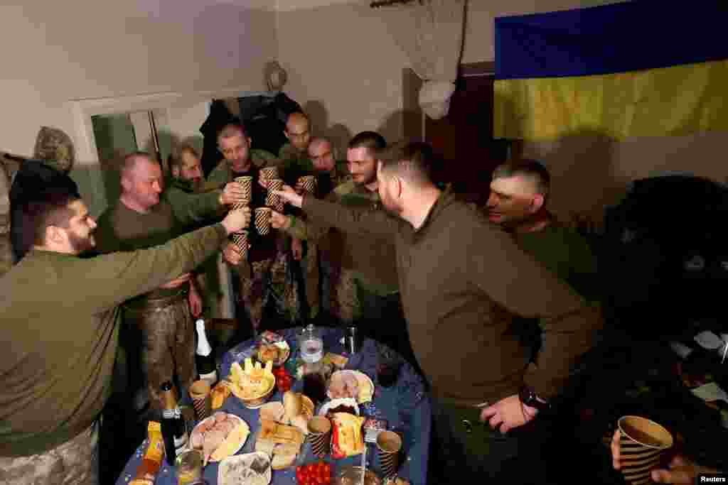 Ukrainian soldiers share a toast to celebrate New Years Eve, in a military rest house n region of Donetsk as Russia&#39;s attack on Ukraine continues, Dec. 31, 2022.