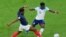 France's Aurelien Tchouameni, left, challenges for the ball with England's Bukayo Saka during the World Cup quarterfinal soccer match between England and France, at the Al Bayt Stadium in Al Khor, Qatar, Dec. 10, 2022. France beat England 2-1.