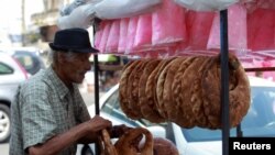 A street vendor arranges 'Kaak' a Lebanese street bread in the southern Lebanese city of Sidon, Sept. 6, 2022. 