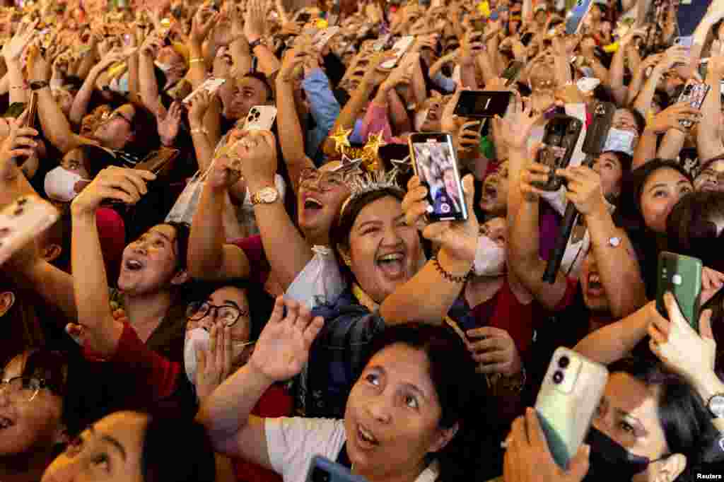 Revelers celebrate during a New Year's Eve party in Quezon City, Metro Manila, Philippines, Dec. 31, 2022.