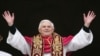 FILE - Pope Benedict XVI, Cardinal Joseph Ratzinger of Germany, waves from a balcony of St. Peter's Basilica, Vatican City, April 19, 2005.