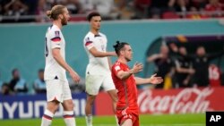 Wales' Gareth Bale reacts after a challenge during the World Cup, group B soccer match between the United States and Wales, at the Ahmad Bin Ali Stadium in in Doha, Qatar, Nov. 21, 2022.