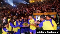 FILE: Cristiano Ronaldo runs out onto the pitch in his new Saudi al-Nassr club colors. Tahen Jan. 4, 2023