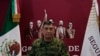 Mexican Defense Secretary Luis Cresencio Sandoval announces the arrest of alleged drug trafficker Ovidio Guzman during a press conference in Mexico City, Jan. 5, 2023. 
