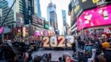People take a look at the giant, seven-foot-tall numerals for "2023", as it arrives for the December 31 Times New Year's Eve celebrations, at Times Square in New York City, Dec. 20, 2022.