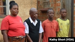 Rachel and David Kutayaya with their children Ruby and Hans at their home in Chowa, Kabwe, Zambia