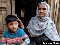 Umme Habiba, 7 — Hatemon Nesa’s eldest daughter with her grandmother Anwara Begum, 55, at Cox’s Bazar, Bangladesh on Jan. 10, 2023.