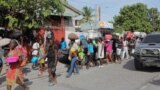 People on the streets of Haiti after being displaced by gang war violence.