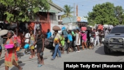 People on the streets of Haiti after being displaced by gang war violence.