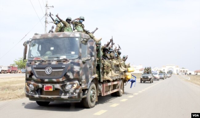 South Sudan soldiers at the Army headquarters in Juma prepare for deployment to the Democratic Republic of Congo, Dec. 28, 2022. (Sheila Ponnie/VOA)