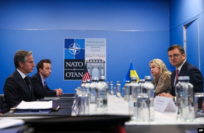 U.S. Secretary of State Antony Blinken meets with Ukraine's Foreign Minister Dmytro Kuleba during the NATO foreign ministers meeting in Bucharest, Romania, Nov. 30, 2022.