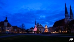 The main square is illuminated in Altoetting, some 90 kilometers east of Munich near Marktl, the birthplace of Pope emeritus Benedict XVI, Germany, Dec. 29, 2022.
