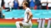 FILE - England's Harry Kane wears a rainbow armband prior to a Euro 2020 soccer championship match at Wembley Stadium. The captains of 7 European nations will not wear anti-discrimination armbands in World Cup games after threats from FIFA to show yellow cards to the players. 
