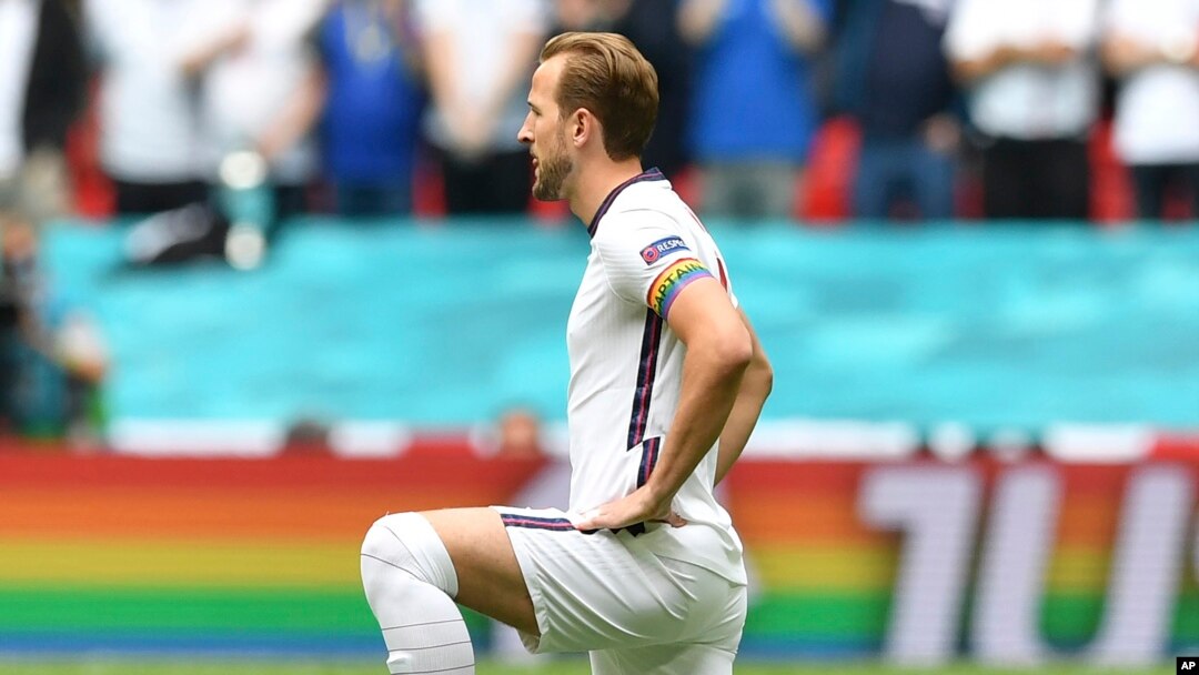 FILE - England's Harry Kane wears a rainbow armband prior to a Euro 2020 soccer championship match at Wembley Stadium. The captains of 7 European nations will not wear anti-discrimination armbands in World Cup games after threats from FIFA to show yellow cards to the players. 