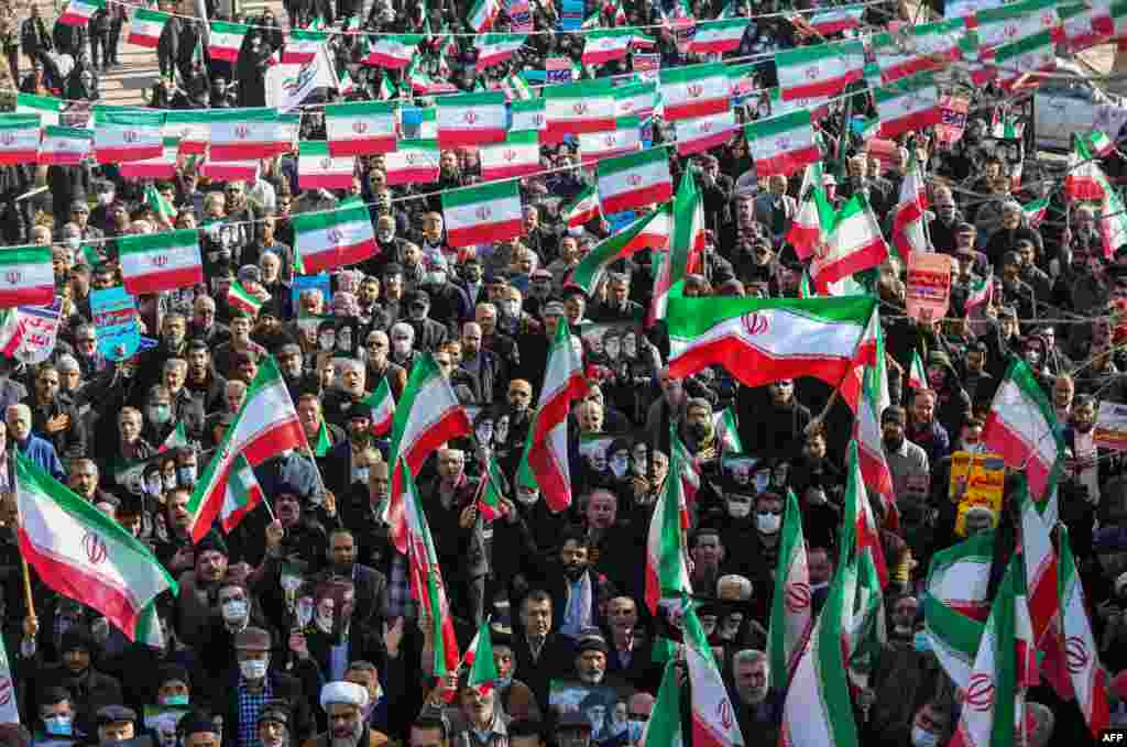 Iranians take part in a pro-government rally in the central city of Hamedan, Iran.