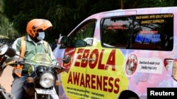 FILE - An Ebola Awareness van drives along Kyadondo Road amid an Ebola outbreak, in Kampala, Uganda, Oct. 27, 2022. The country has registered no new cases since late November.