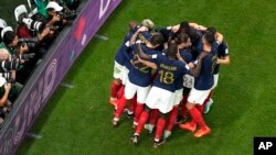 French players celebrate after Kylian Mbappe scored his third goal during the World Cup group D soccer match between France and Australia, at the Al Janoub Stadium in Al Wakrah, Qatar, Nov. 22, 2022.