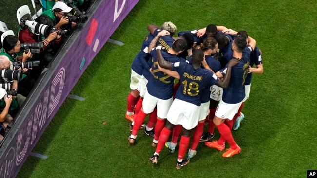 French players celebrate after Kylian Mbappe scored his third goal during the World Cup group D soccer match between France and Australia, at the Al Janoub Stadium in Al Wakrah, Qatar, Nov. 22, 2022.
