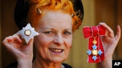 FILE - Dame Vivienne Westwood poses for a photo after collecting her insignia from Britain's Prince Charles during an Investiture ceremony at Buckingham Palace, London on June. 9, 2006. 