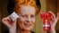 FILE - Dame Vivienne Westwood poses for a photo after collecting her insignia from Britain's Prince Charles during an Investiture ceremony at Buckingham Palace, London on June. 9, 2006. 