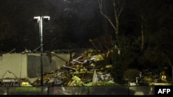 This Dec. 10, 2022, photo shows the rubble of a low-rise apartment block after an explosion in Saint-Helier, Jersey Island, killed three people, authorities said. 