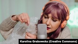 A woman pops bubble wrap in front of a microphone to highlight the sound. The image illustrates Autonomous Sensory Meridian Response, also known as ASMR.