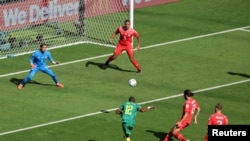 Cameroonian forward Karl Toko Ekambi takes a shot at goal during a Group G match against Switzerland at the 2022 FIFA World Cup, Qatar, November 22, 2022.