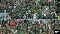 Saudi supporters cheers during the Qatar 2022 World Cup Group C football match between Argentina and Saudi Arabia at the Lusail Stadium in Lusail, north of Doha on November 22, 2022.