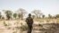 A soldier with the Gambian Armed Forces patrol team stands guard in Baleni on April 23, 2022. 