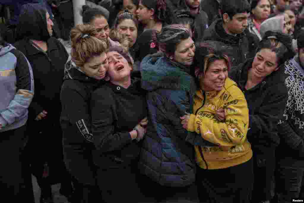 Relatives and friends mourn during the funeral procession of Costas Fragoulis, a 16-year old Roma who was shot and killed by police, in Thessaloniki, Greece.