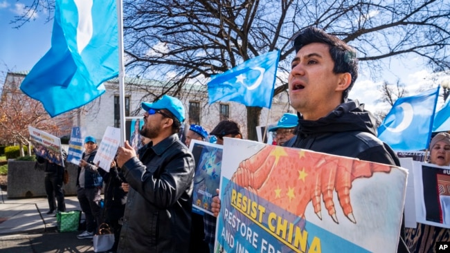 Amanalla Kashgari of Ashburn, Virginia and with the East Turkistan Youth Congress, protests against China and in support of the Uyghur people in the wake of the Urumqi fire in China, Nov. 28, 2022, outside the State Department in Washington.