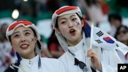 Fans cheer before the World Cup group H soccer match between South Korea and Portugal, at the Education City Stadium in Al Rayyan, Qatar, Dec. 2, 2022. 