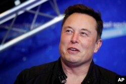 FILE - Elon Musk attends an event in Berlin, Dec. 1, 2020.