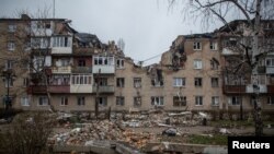 A view shows a residential building damaged by a Russian military strike, amid Russia's attack on Ukraine, in Bakhmut, Ukraine, Dec. 18, 2022. 