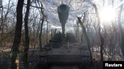 A German howitzer Panzerhaubitze 2000 is disguised by the Ukrainian army of the 43rd Heavy Artillery Brigade, as Russia's attack on Ukraine continues, near Soledar, Ukraine, Jan. 11, 2023.