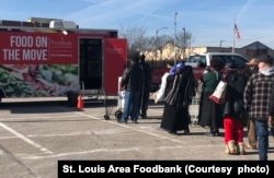 Food on the Move Program by the St. Louis Area Food Bank, February 28, 2022. This program delivers supplies to people in various parts of the community, including churches and high schools.