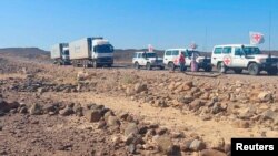 FILE - A convoy of trucks from the International Committee of the Red Cross transports supplies on the road to Mekelle, in Tigray region, Ethiopia, Nov. 15, 2022. The World Health Organization said on Dec. 2, 2022, that it still lacked full access to the region.