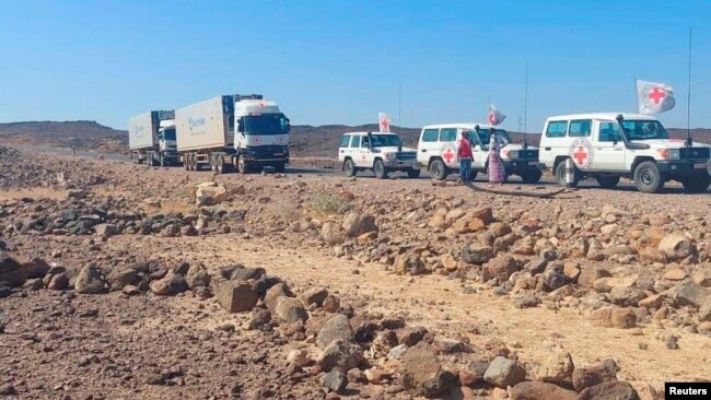 FILE - A convoy of trucks from the International Committee of the Red Cross transports supplies on the road to Mekelle, in Tigray region, Ethiopia, Nov. 15, 2022. The World Health Organization said on Dec. 2, 2022, that it still lacked full access to the region.