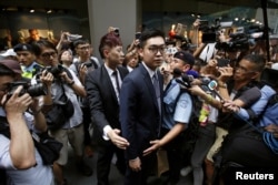 FILE - Andy Chan, a founder of the Hong Kong National Party, leaves the Foreign Correspondents' Club in Hong Kong, China Aug. 14, 2018.