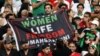 Iran fans hold a banner reading 'Woman life freedom' inside the stadium during the Group B match between England and Iran at Khalifa International Stadium, Doha, Qatar, on Nov. 21, 2022.