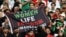 Iran fans hold a banner reading 'Woman life freedom' inside the stadium during the Group B match between England and Iran at Khalifa International Stadium, Doha, Qatar, on Nov. 21, 2022.