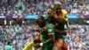 Cameroon's Vincent Aboubakar and Eric Maxim Choupo-Moting celebrate a goal against Serbia at the 2022 FIFA World Cup, November 28, 2022