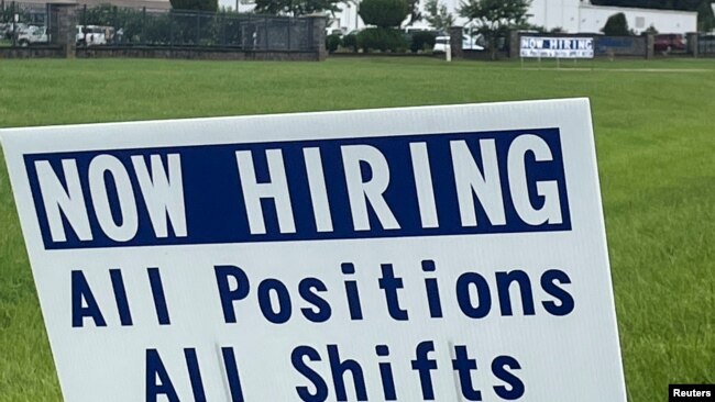 FILE - A sign advertising jobs stands near the SMART Alabama, LLC auto parts plant and Hyundai Motor Co. subsidiary, in Luverne, Alabama, July 14, 2022.