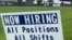 FILE - A sign advertising jobs stands near the SMART Alabama, LLC auto parts plant and Hyundai Motor Co. subsidiary, in Luverne, Alabama, July 14, 2022.