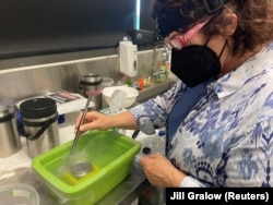 Mary Hagedorn works with modern-mesh technology in liquid nitrogen at AIMS in Townsville, Australia December 14, 2022. (REUTERS/Jill Gralow)