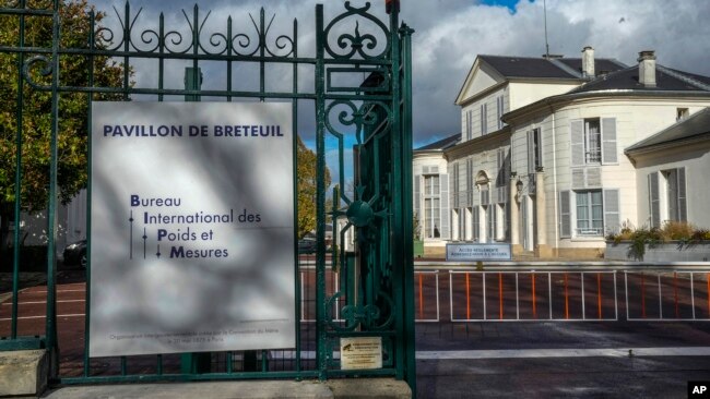 The entrance of the International Bureau of Weights and Measures is pictured in Sevres, outside Paris, Thursday, Nov. 17, 2022. (AP Photo/Michel Euler)