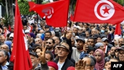 FILE: Tunisian demonstrators take part in a rally against President Kais Saied, called for by the opposition "National Salvation Front" coalition, in the capital Tunis. Taken December 10, 2022. 