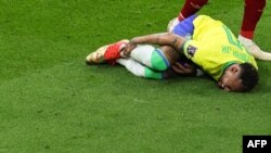 Brazil's forward Neymar gestures on the ground during the Qatar 2022 World Cup Group G football match between Brazil and Serbia at the Lusail Stadium in Lusail, north of Doha on November 24, 2022.