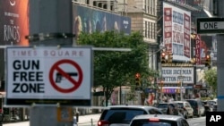 FILE - A sign reading "Gun Free Zone" is posted near around Times Square, Aug. 31, 2022, in New York. 