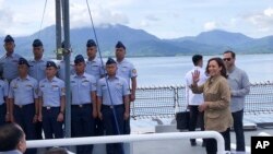 In this photo provided by the Philippine Coast Guard, U.S. Vice President Kamala Harris waves on board the Philippine Coast Guard BRP Teresa Magbanua (MRRV-9701) during her visit to Puerto Princesa, Palawan province, western Philippines, Nov. 22, 2022. 